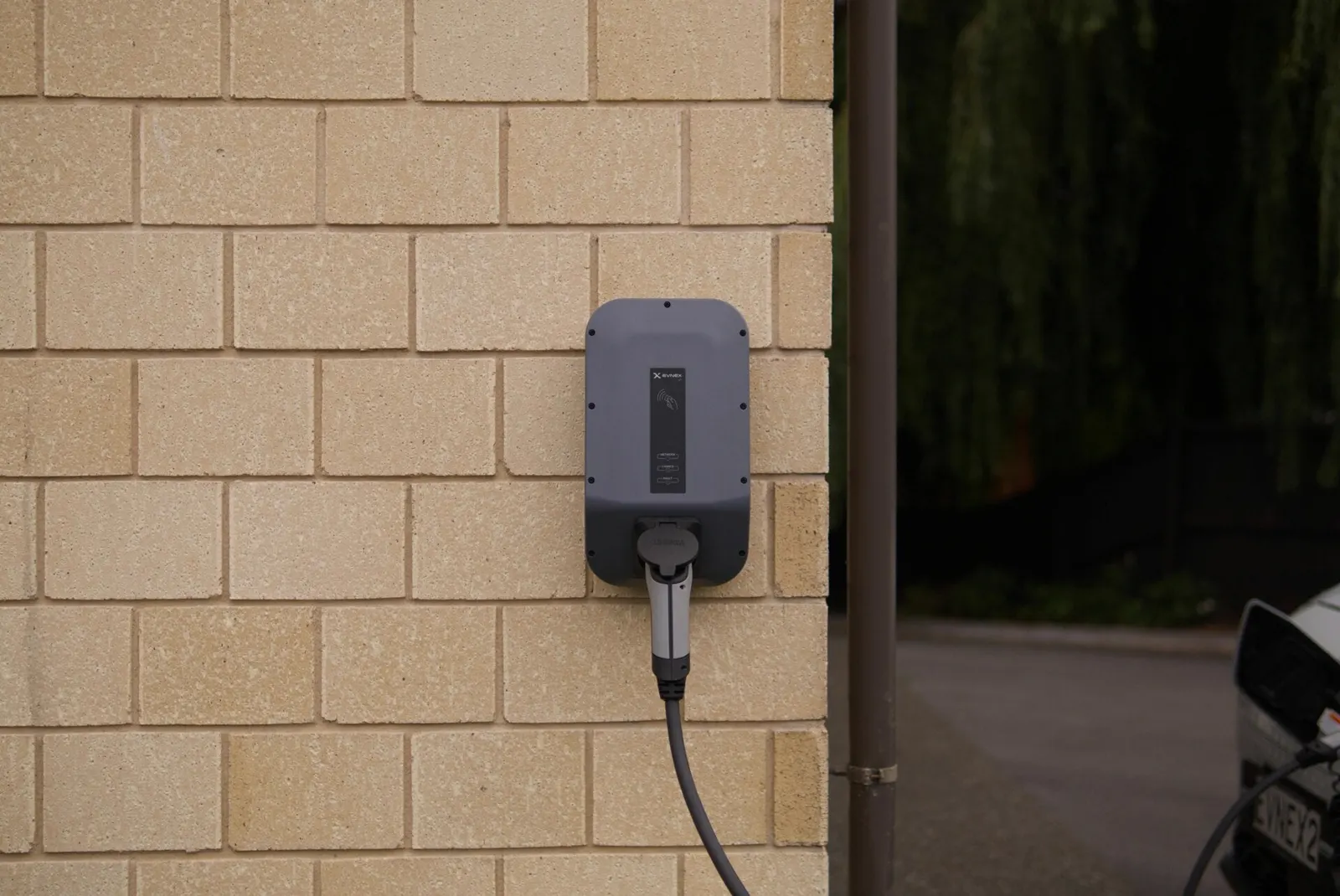 Level 2 charger plugged into an EV overnight
