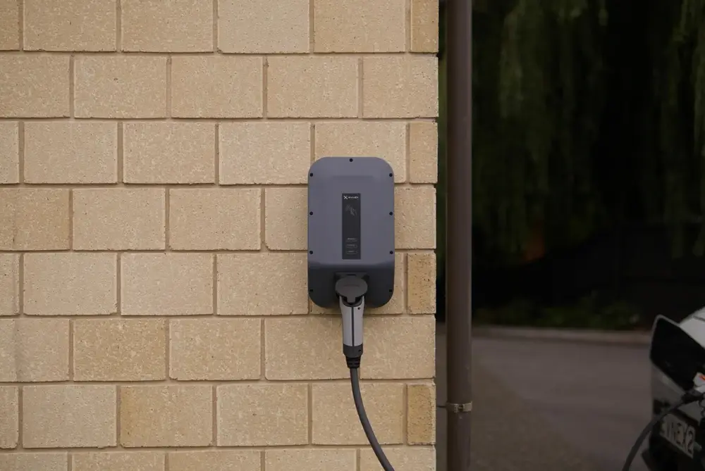 Level 2 charger plugged into an EV overnight